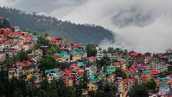 View of houses and fog over Shimla, India