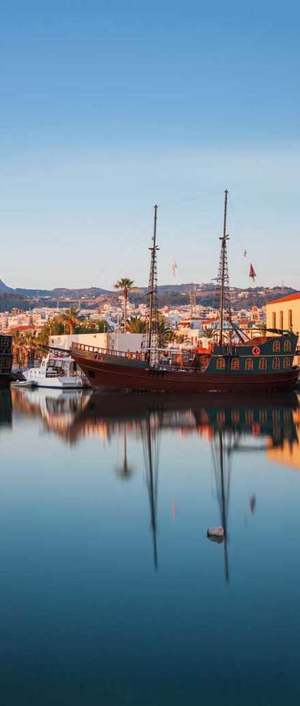 Panorama Of Old Harbour In Rethymnon With Lighthouse At Sunrise, Crete, Greece