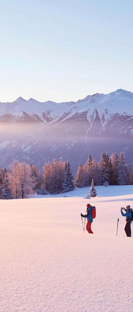 Couple skiing in snow, Schneeschuhwandern Simmering, Austria