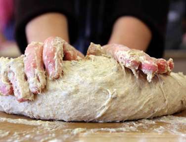 Bread dough being kneaded