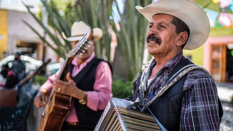 Man playing in Town Square, Mexico