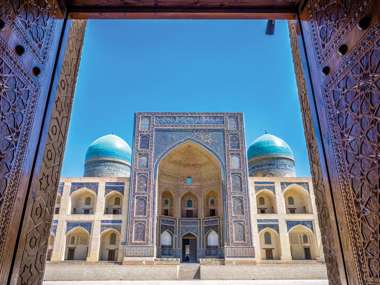 View To Mir I Arab Madrassa Thru The Old Wooden Carved Door, Bukhara, Uzbekistan 