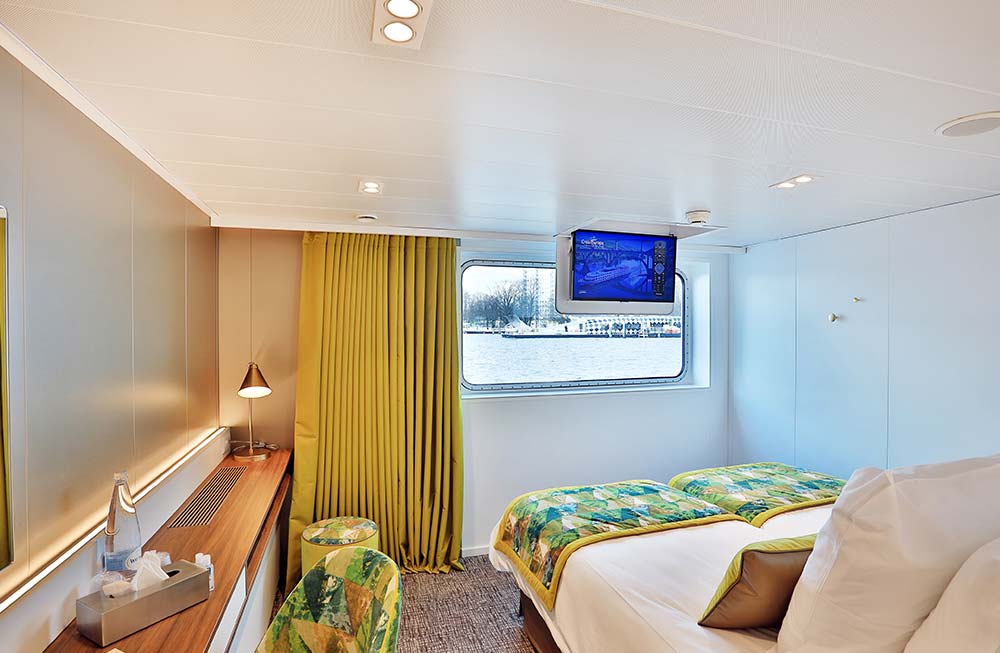 MS Elbe Princesse II Vessel, Germany, Lower Deck Cabin with TV showing