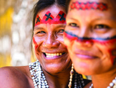 Native Brazilian Women Smiling At An Indigenous Tribe In The Amazon, Brazil